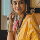 Meenakshi Chaudhary in Pushpanjali Yellow Banarasi Handwoven Silk Saree